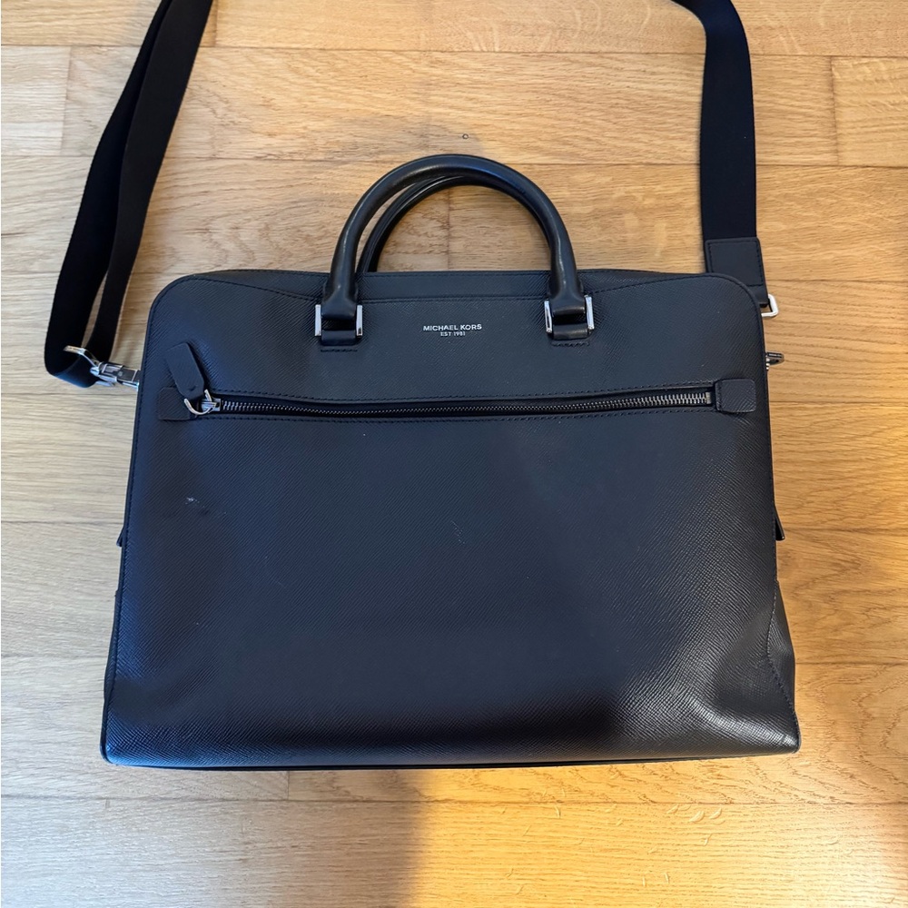 Michael Kors Leather Brief case. 2 top zippers and one front zippered pouch.